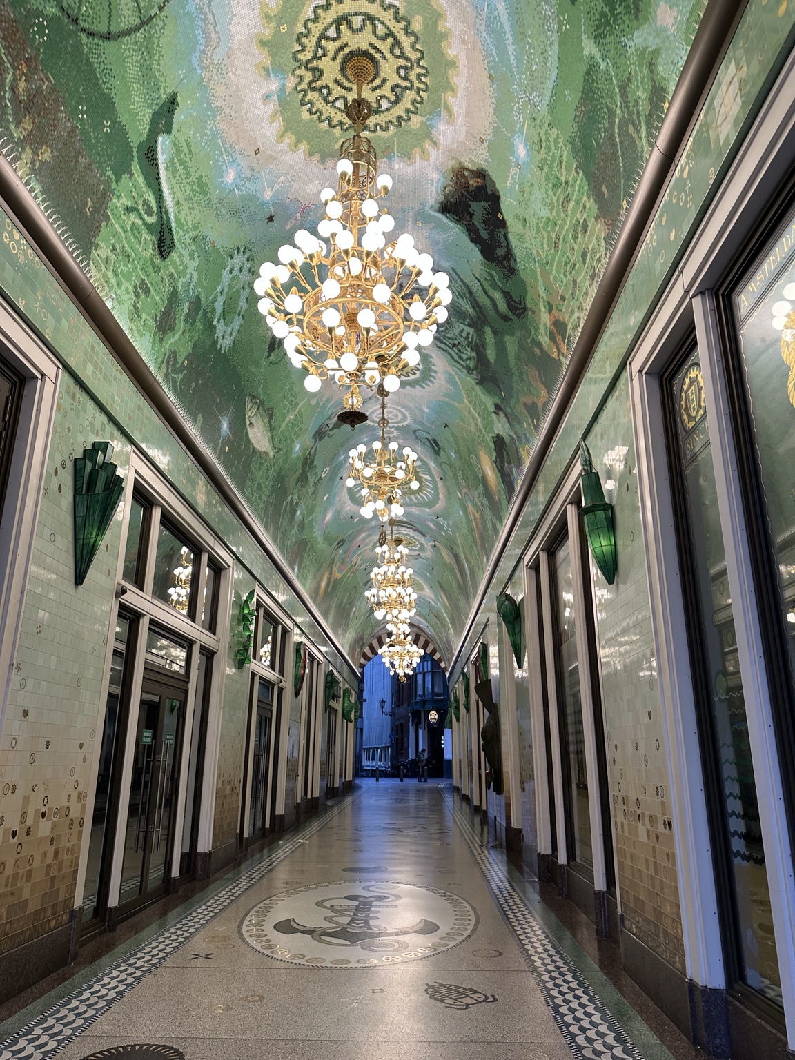 A chandelier-lit shopping passage in Amsterdam