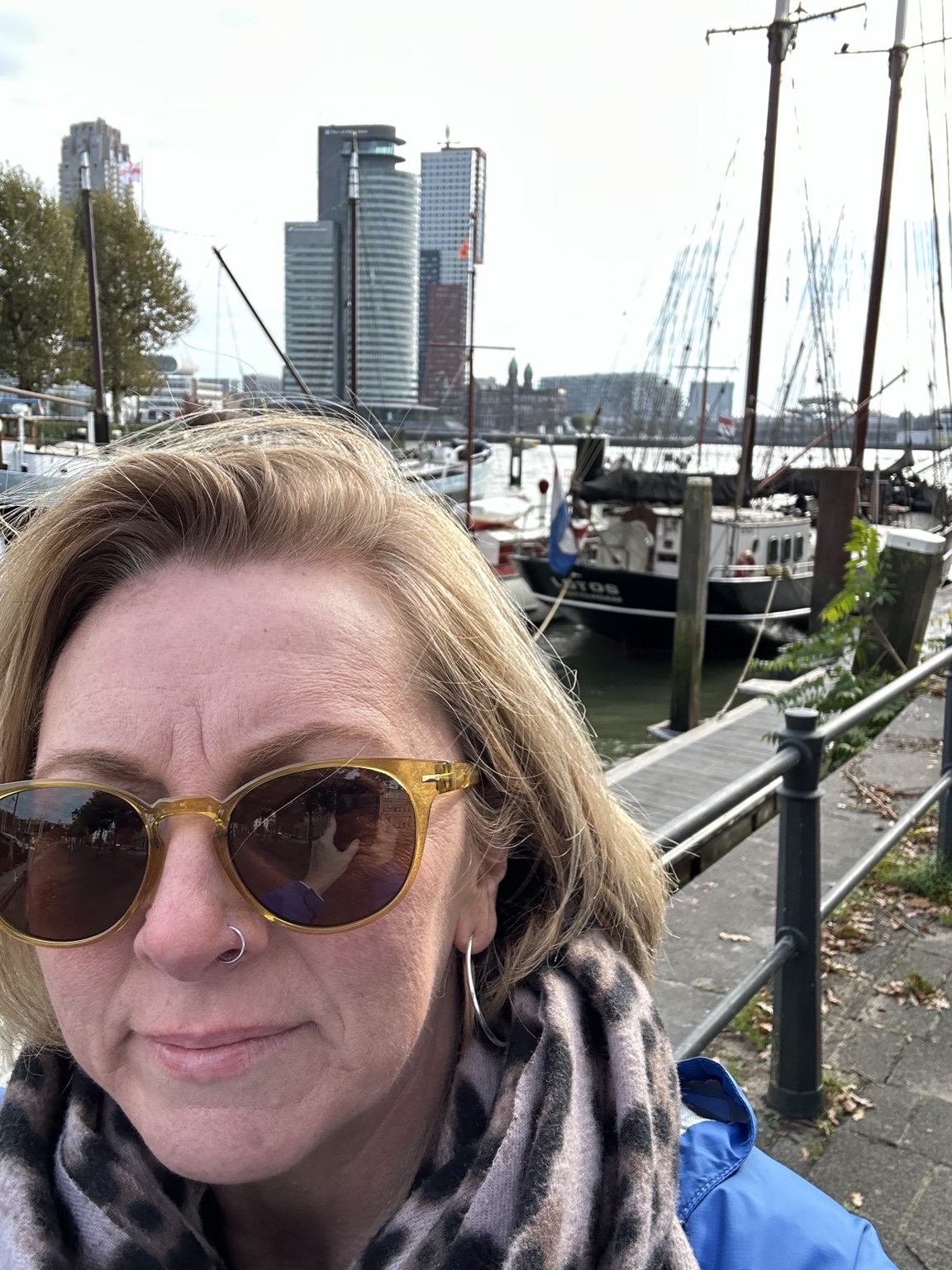 Jamie beside Rotterdam's waterfront skyline