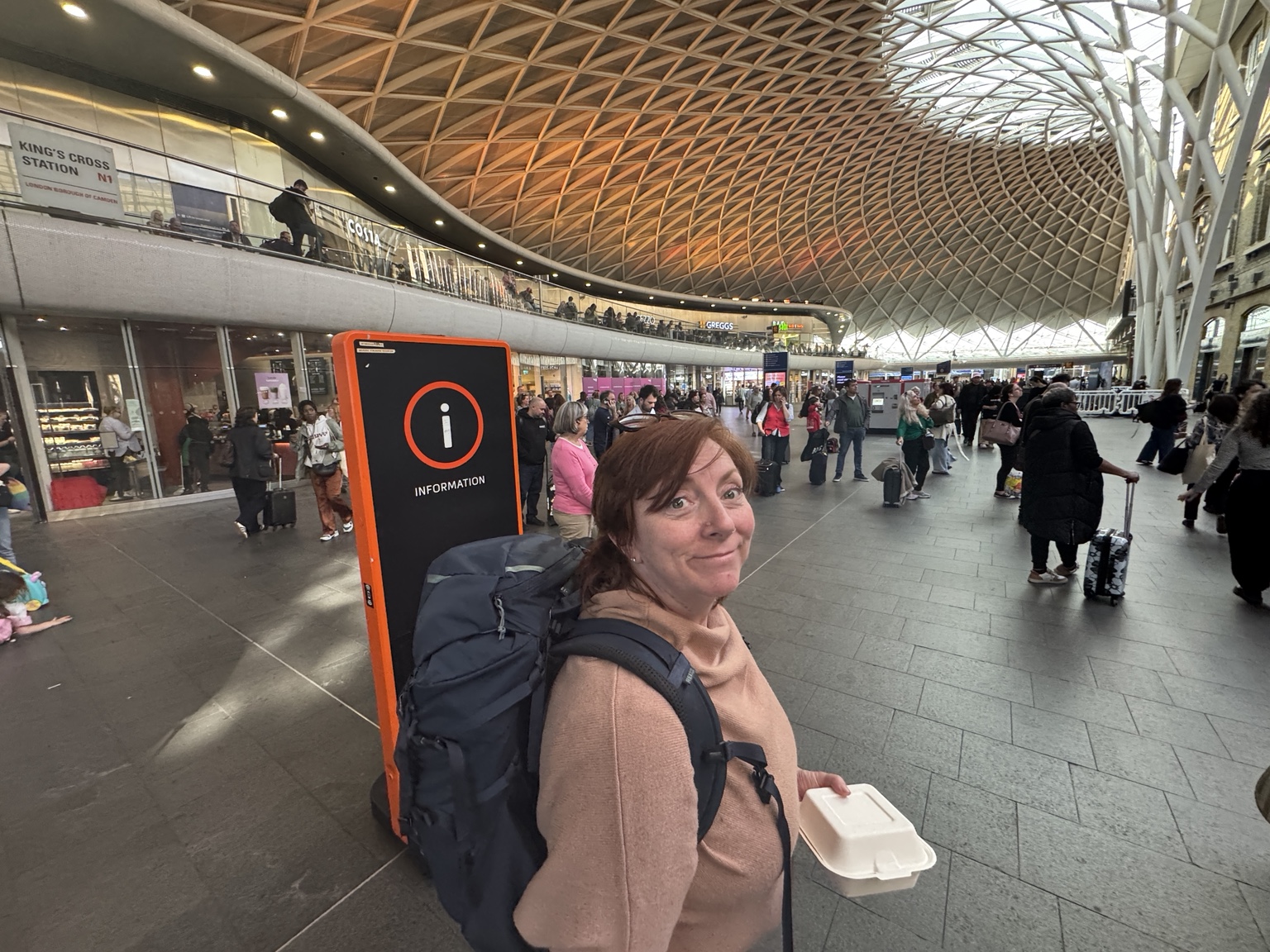 Jamie wearing her travel backpack at King’s Cross Station