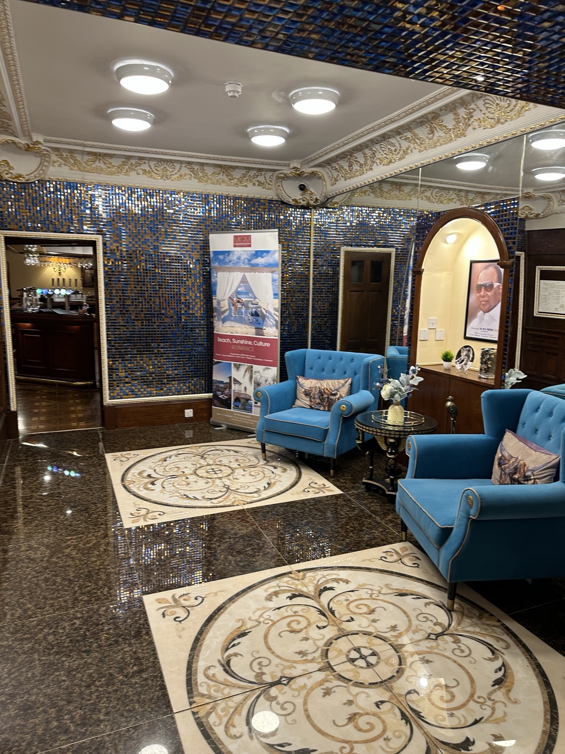 The ornate blue and gold lobby of the Muthu Fort William hotel