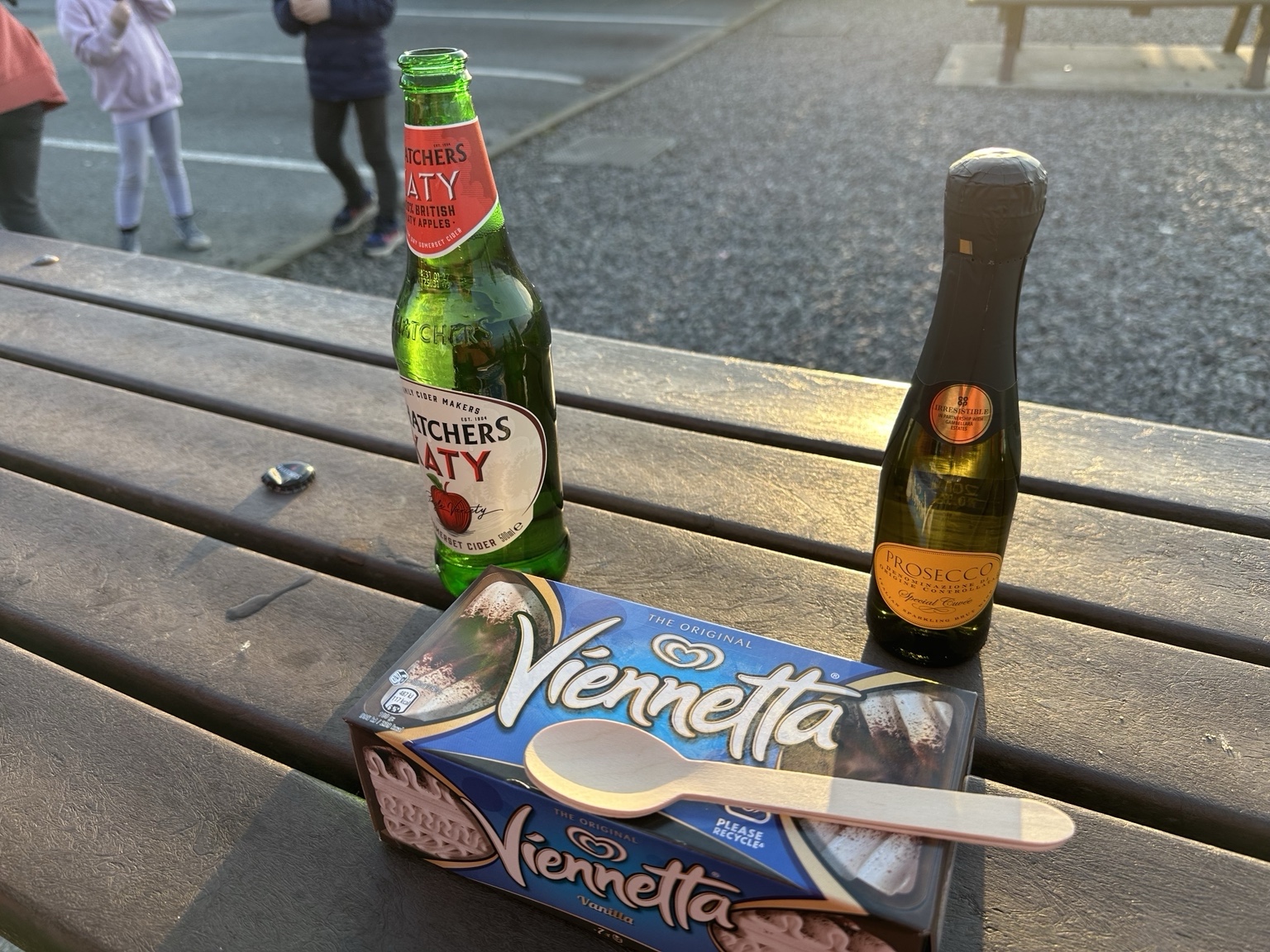 An unopened Viennetta with cider and a small bottle of Prosecco